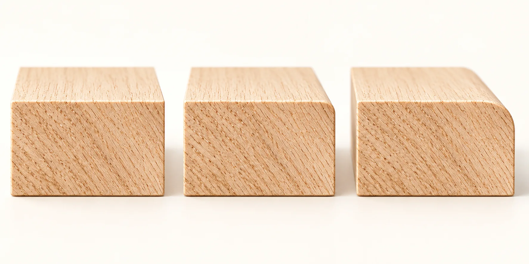 Three wooden samples comparing a square edge with smaller and larger rounded edges.